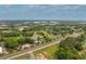 Aerial view of a neighborhood with lush greenery, showcasing homes and the surrounding area with its mature trees at 525 E Main St, Buford, GA 30518