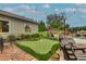 Landscaped backyard offers a putting green, lush landscaping, swimming pool and brick patio perfect for entertaining at 525 E Main St, Buford, GA 30518