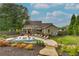 Stunning backyard with a sparkling pool, inviting lounge area, and meticulous landscaping provides a serene oasis at 525 E Main St, Buford, GA 30518