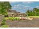 Beautiful backyard features a pool, patio with outdoor seating, and lush landscaping at 525 E Main St, Buford, GA 30518