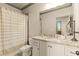 Stylish bathroom featuring granite countertops, white cabinets, and modern fixtures at 525 E Main St, Buford, GA 30518