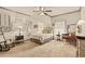 Relaxing bedroom with vintage decor and plenty of light at 525 E Main St, Buford, GA 30518