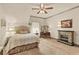 Calm bedroom features a fireplace and soft lighting at 525 E Main St, Buford, GA 30518