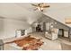 Cozy bonus room features comfortable seating, a decorative rug, and a ceiling fan at 525 E Main St, Buford, GA 30518