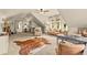 Spacious bonus room features neutral decor, large area rug, and ample natural light at 525 E Main St, Buford, GA 30518
