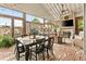 Cozy dining area with exposed brick, fireplace, string lights, & comfy seating at 525 E Main St, Buford, GA 30518
