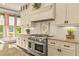 Modern kitchen features granite countertops, stainless steel appliances and gas range at 525 E Main St, Buford, GA 30518