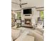 Cozy living room features fireplace, ceiling fan and comfortable seating at 525 E Main St, Buford, GA 30518