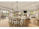Open concept floor plan includes the dining room, living room, and an abundance of natural light at 525 E Main St, Buford, GA 30518