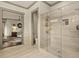 Open main bathroom featuring a glass-enclosed shower, tiled walls, and modern fixtures with an adjacent area at 525 E Main St, Buford, GA 30518