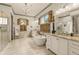 Luxurious main bathroom featuring a soaking tub, dual vanities, walk-in shower, and stylish fixtures at 525 E Main St, Buford, GA 30518