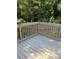 View of the deck with wood flooring and a view of the trees surrounding the backyard at 6914 N Baggett Rd, Douglasville, GA 30134