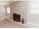 A stylish fireplace with a decorative screen and neutral-toned tiling at 6914 N Baggett Rd, Douglasville, GA 30134