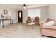 Bright living room showcases new flooring, a stylish front door, and cozy seating arrangement at 6914 N Baggett Rd, Douglasville, GA 30134