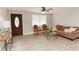 Inviting living room featuring new flooring, a stylish front door, and ample natural light from the large window at 6914 N Baggett Rd, Douglasville, GA 30134