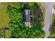 Aerial view of home, nestled among mature trees and greenery, providing privacy and a serene setting at 1590 Greyson Rdg, Marietta, GA 30062