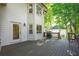 Spacious wooden back deck perfect for entertaining with grill and view of the wooded backyard at 1590 Greyson Rdg, Marietta, GA 30062