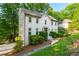 Inviting two-story home with a brick facade, landscaped front yard, and a welcoming entrance at 1590 Greyson Rdg, Marietta, GA 30062