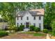 Classic two-story brick home with manicured landscaping, exuding charm and inviting curb appeal at 1590 Greyson Rdg, Marietta, GA 30062