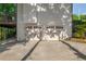 Two-car garage with carriage-style doors and concrete driveway, blending functionality with curb appeal at 1590 Greyson Rdg, Marietta, GA 30062