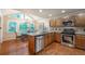 Open kitchen featuring granite countertops, stainless steel appliances, and an adjacent breakfast nook at 1590 Greyson Rdg, Marietta, GA 30062