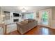 Comfortable living room with built-in shelves, a fireplace, a plush rug and deck access at 1590 Greyson Rdg, Marietta, GA 30062