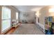 Cozy playroom with 'PLAY' decor, plush rug, and organized shelving, creating a fun space at 1590 Greyson Rdg, Marietta, GA 30062