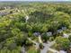 Aerial view of homes in a wooded neighborhood near water at 165 Colony Cir, Canton, GA 30114