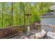 The home features a back deck with space heater and wooded views at 165 Colony Cir, Canton, GA 30114
