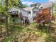 The house has a backyard and a two level wooden deck at 165 Colony Cir, Canton, GA 30114