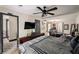 Spacious bedroom featuring a ceiling fan, and an adjoining bathroom and living space at 165 Colony Cir, Canton, GA 30114
