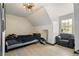 Spacious bonus room featuring a ceiling fan and large window at 165 Colony Cir, Canton, GA 30114