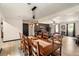 Open concept dining room with wood table, light floors, and access to the living room at 165 Colony Cir, Canton, GA 30114