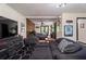 Spacious living room with modern furniture, a large TV, and a view to the bedroom at 165 Colony Cir, Canton, GA 30114