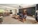 Bright and open living room featuring modern furnishings, wood-look flooring, and decorative wall paneling at 165 Colony Cir, Canton, GA 30114