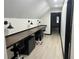 A modern office space with three built-in workstations and overhead lighting, perfect for a home office or study area at 165 Colony Cir, Canton, GA 30114