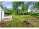 Expansive backyard featuring a well-maintained lawn and mature trees offering plenty of shade at 2702 Galaxy Ct, Decatur, GA 30034