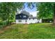 The residence's expansive backyard features a covered patio and lush lawn at 2702 Galaxy Ct, Decatur, GA 30034