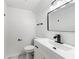 Clean and modern half-bathroom with a stylish vanity, mirror, and fixtures at 2702 Galaxy Ct, Decatur, GA 30034