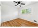 Bright bedroom with hardwood floors, a ceiling fan, and a window providing natural light at 2702 Galaxy Ct, Decatur, GA 30034
