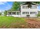 Charming two-story home with a well-manicured front yard, lovely blue door, and black shutters at 2702 Galaxy Ct, Decatur, GA 30034