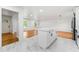 Charming kitchen featuring white marble-style floors, an island with a countertop, and recessed lighting at 2702 Galaxy Ct, Decatur, GA 30034