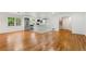 Spacious living room boasts hardwood floors and an open layout with a view into the modern kitchen at 2702 Galaxy Ct, Decatur, GA 30034