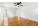 Inviting main bedroom with hardwood floors, an ensuite bathroom, a ceiling fan, and lots of natural light at 2702 Galaxy Ct, Decatur, GA 30034