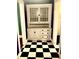 Charming built-in hutch with black-and-white checkerboard floors at 3366 College St, College Park, GA 30337