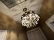 Intricate crystal chandelier hangs from the ceiling adding elegance to the room's décor at 3366 College St, College Park, GA 30337