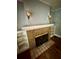Close up of the fireplace and mantle with built-in shelves at 3366 College St, College Park, GA 30337