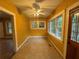 Sunroom featuring natural light with yellow walls and neutral flooring at 3366 College St, College Park, GA 30337