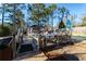 Backyard with a deck, table, chairs, lush trees, and an inviting gazebo at 1830 Brandy Se Ln, Conyers, GA 30013