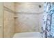 Bathroom showcasing a tiled shower and tub combination at 1830 Brandy Se Ln, Conyers, GA 30013